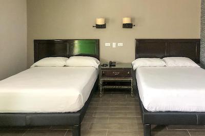 Capital O Palms Hotel